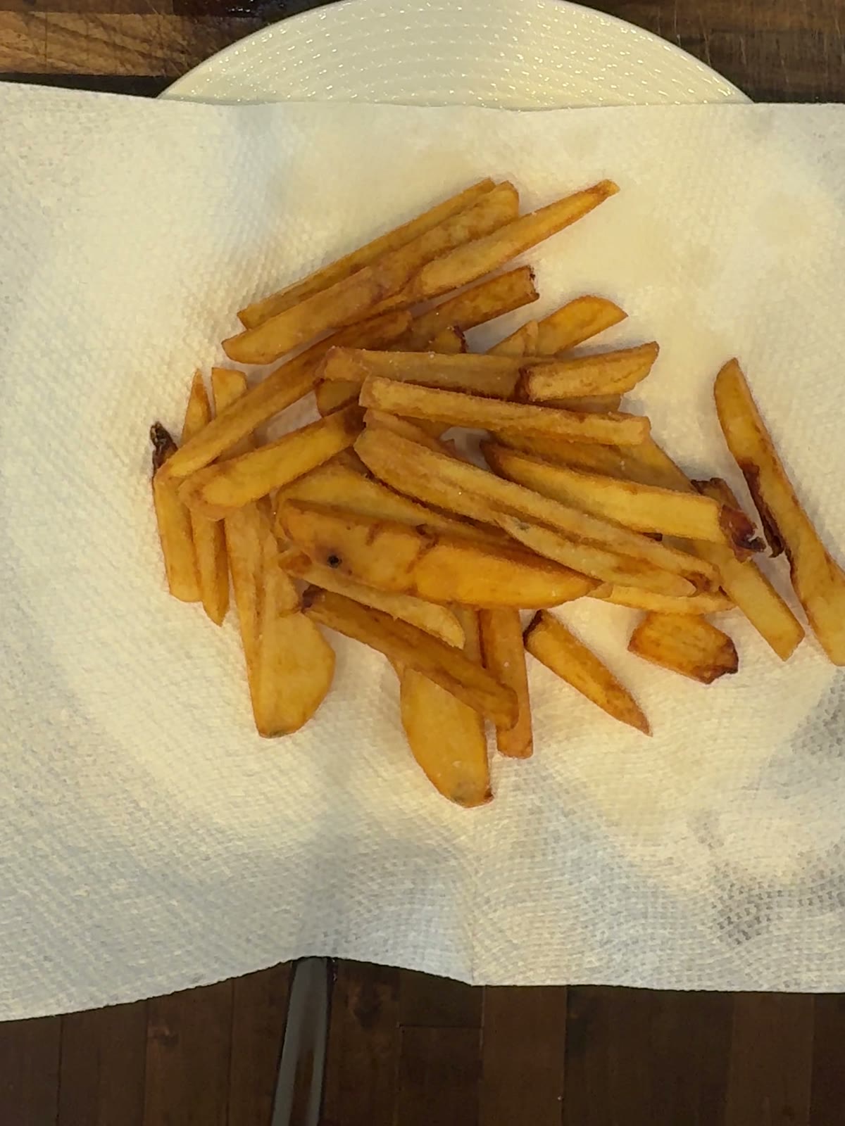 A pile of golden crispy homemade french fries